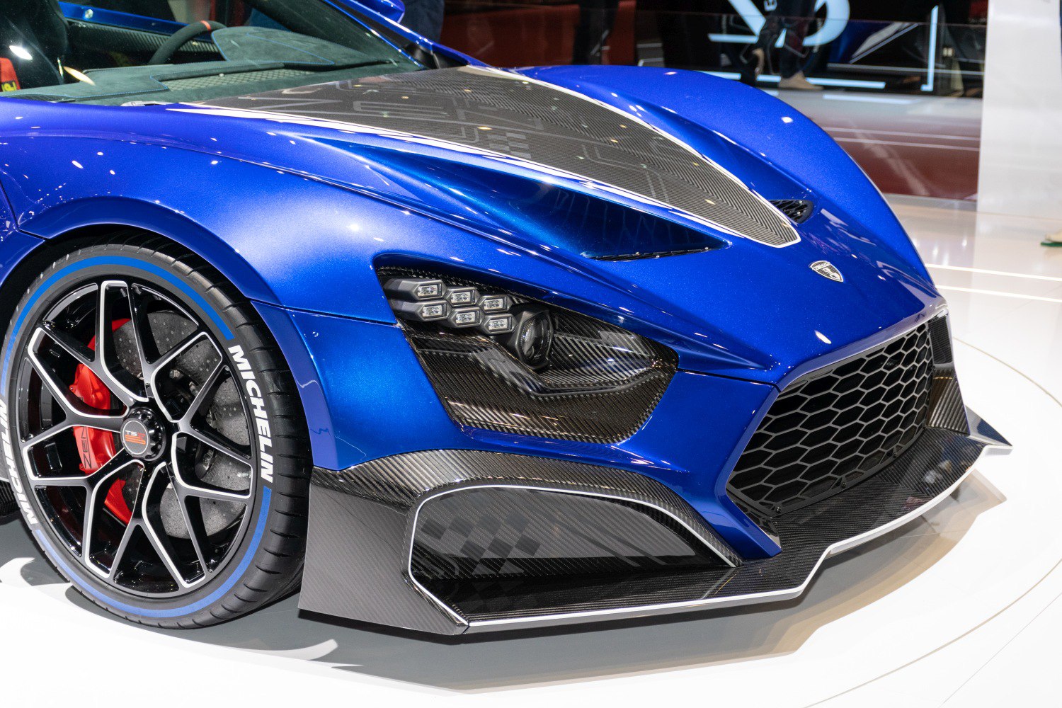Front view with carbon fiber hood, LED headlights, and sporty aerodynamic bumper