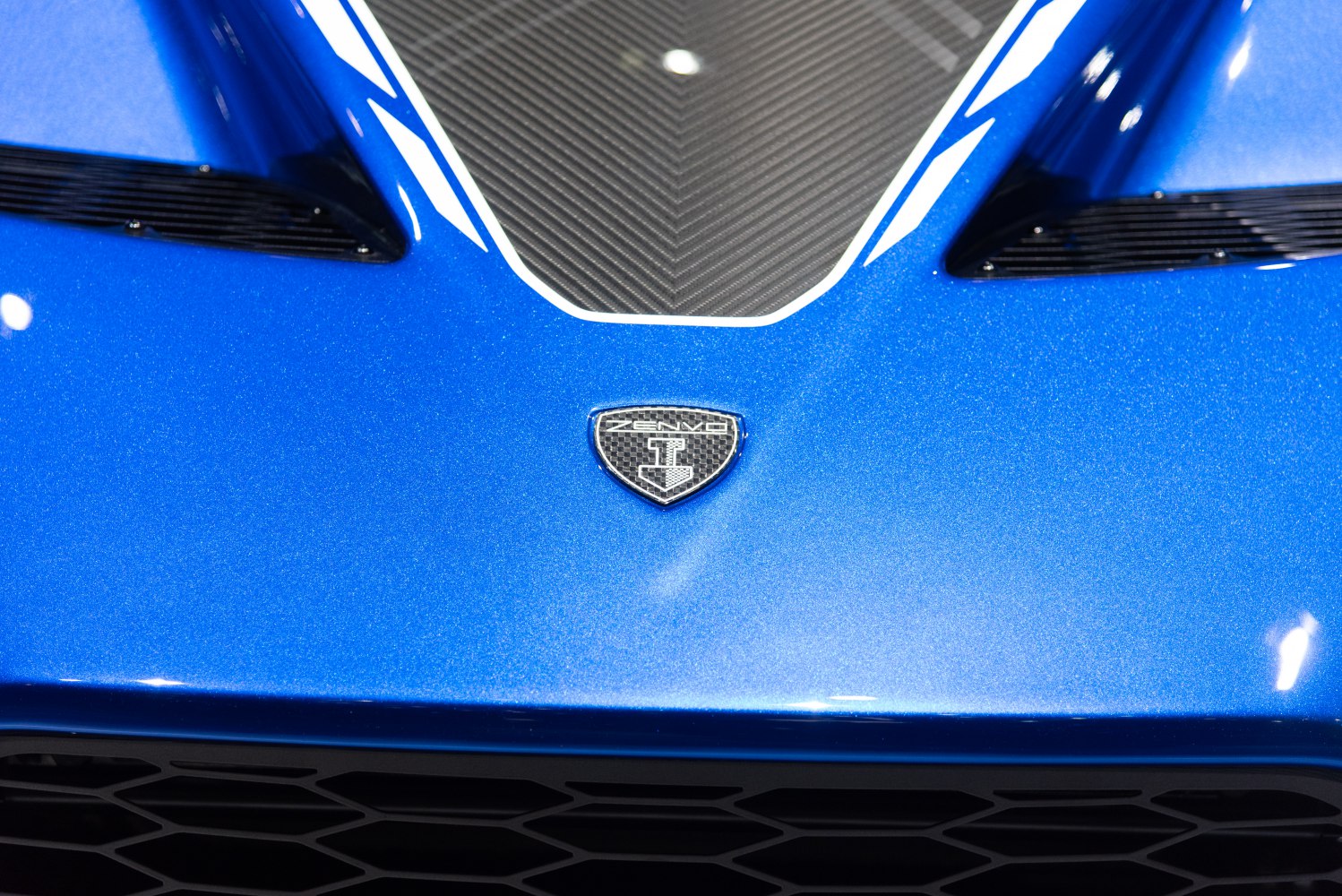 Blue front hood with carbon fiber inlay and air vents
