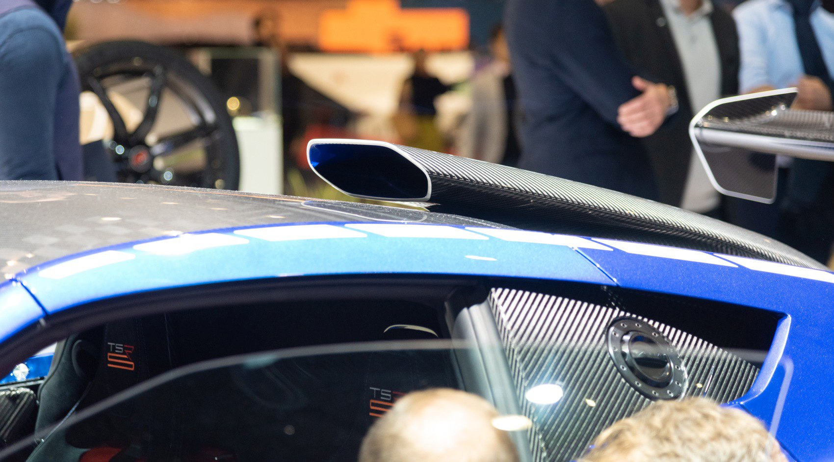 Close-up of side air intake and carbon fiber rear wing