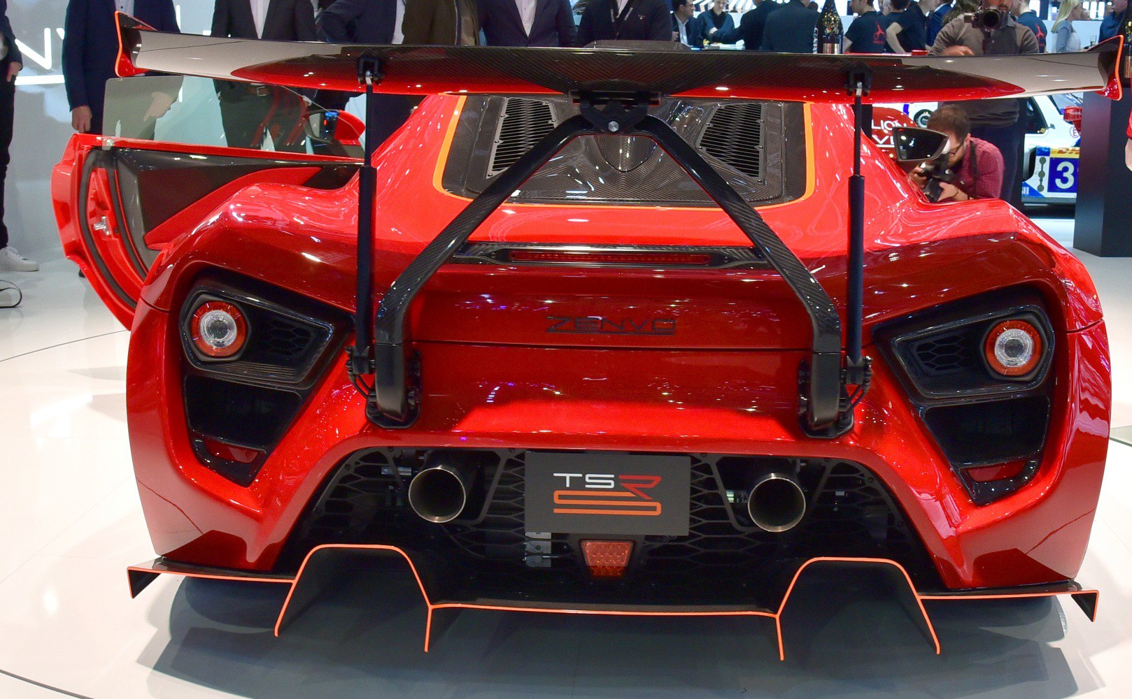 Rear view with large rear wing and dual exhaust