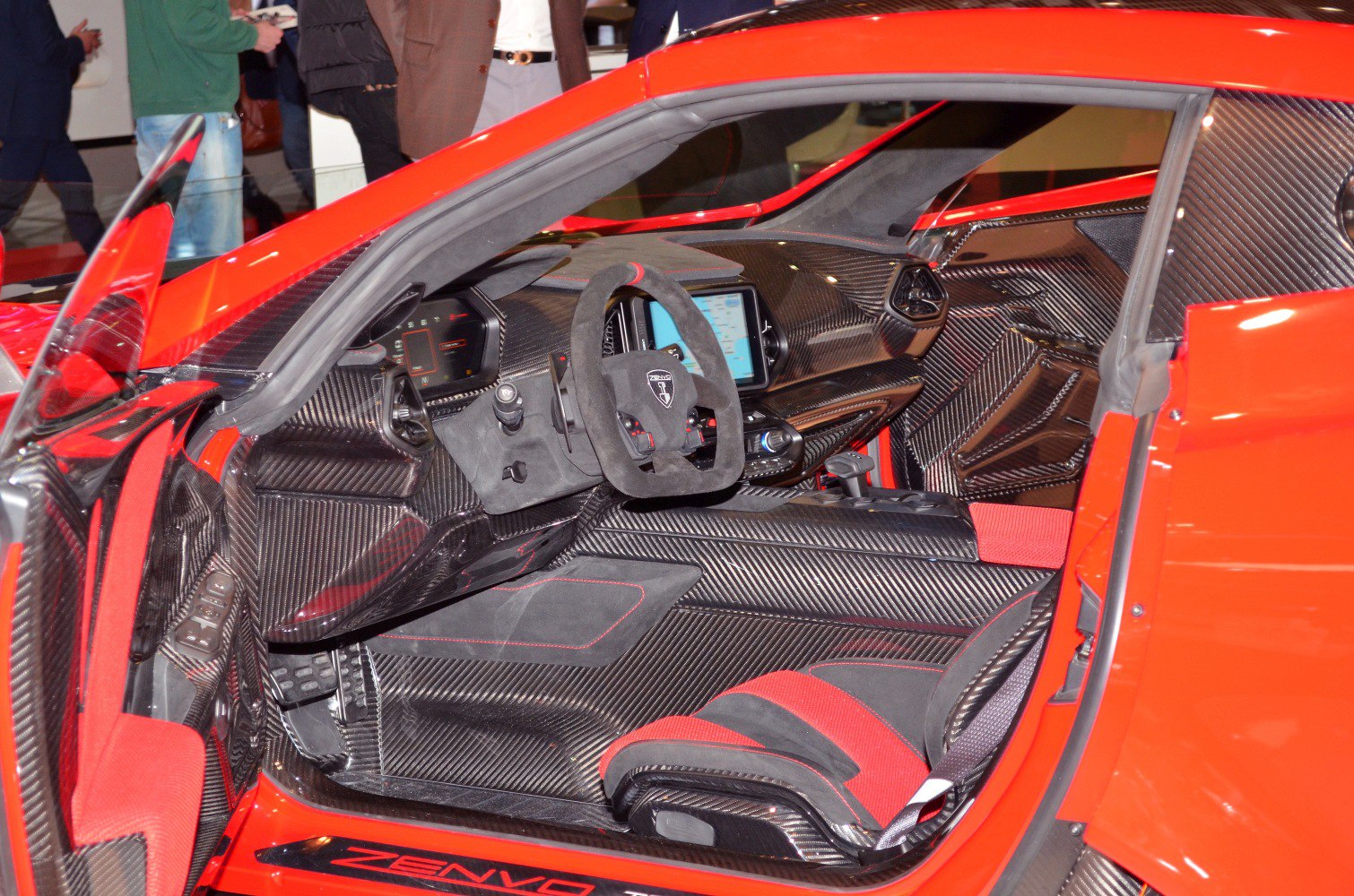 Carbon fiber interior with racing seats and digital cockpit