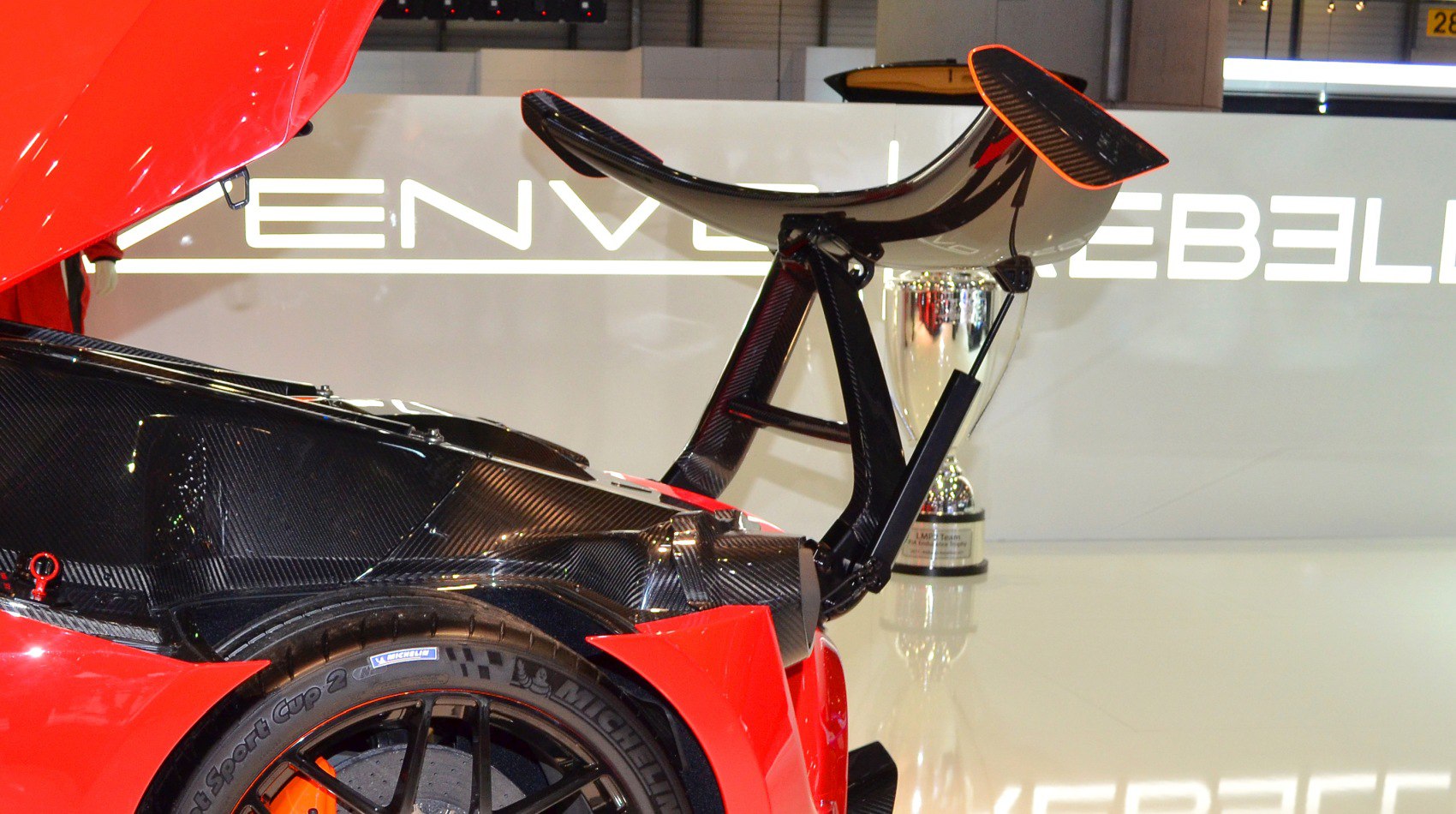 Rear carbon fiber wing and black alloy wheel with Michelin tire
