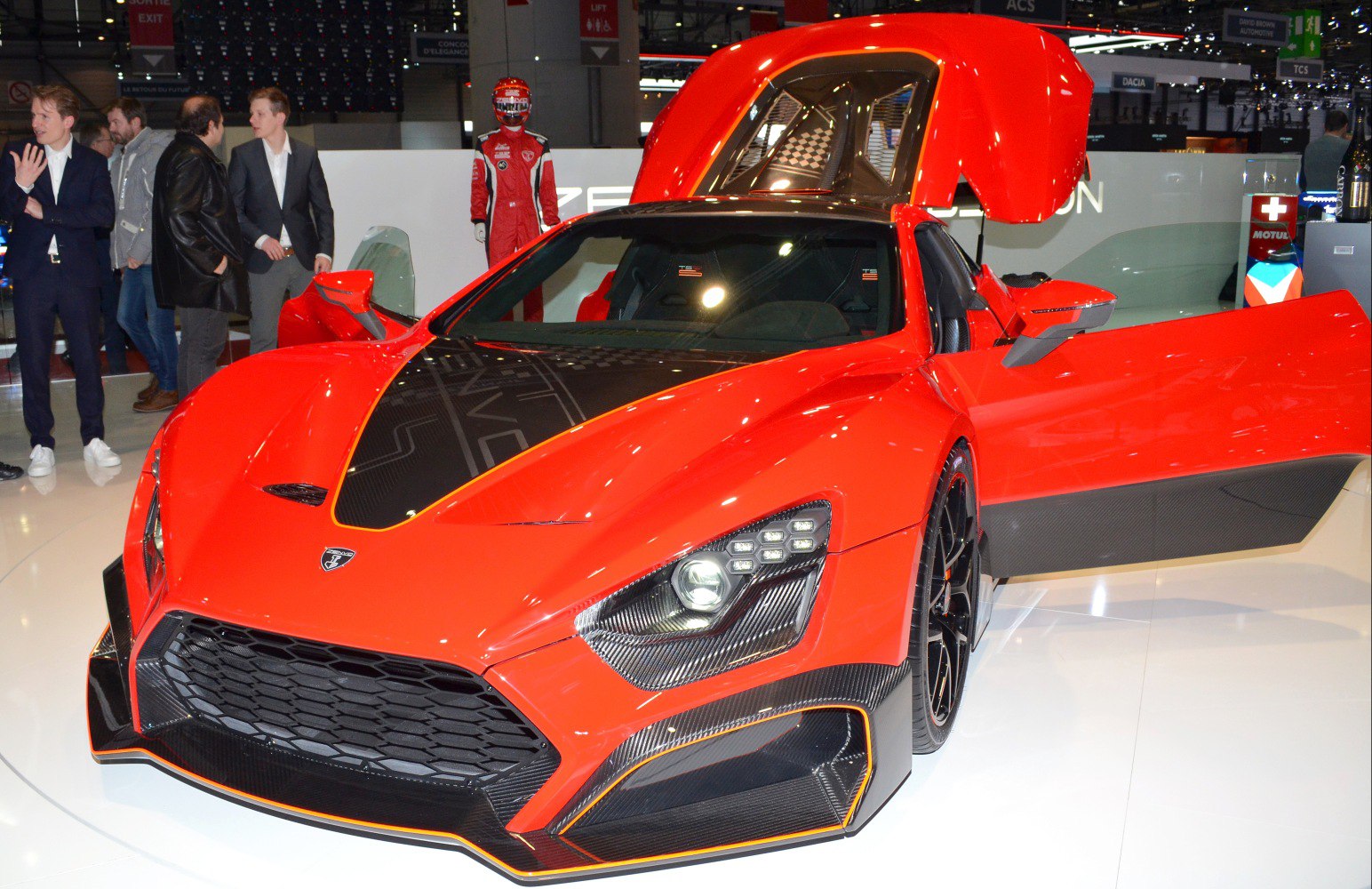 High-performance red hypercar with open doors, rear hatch, and LED headlights