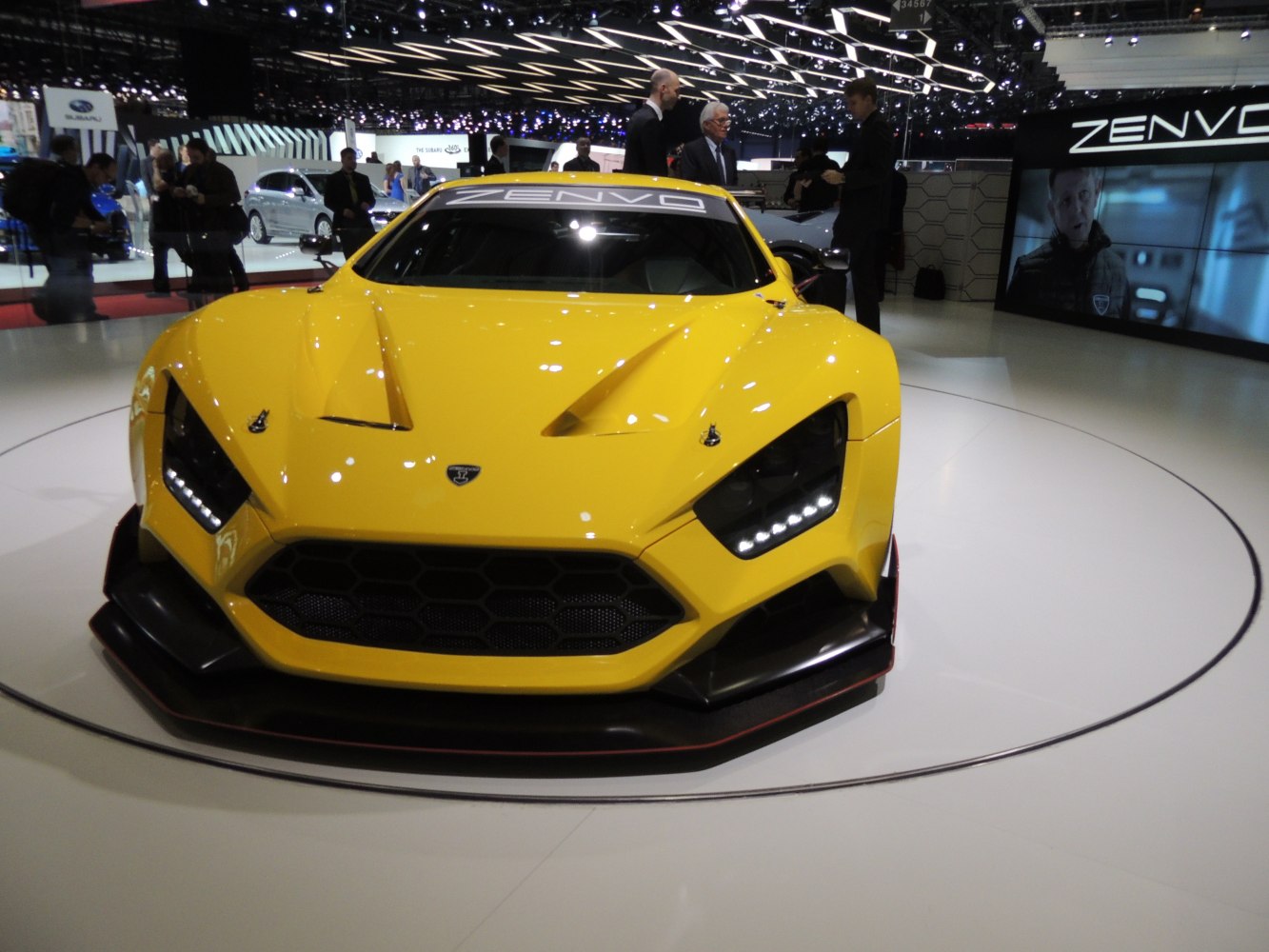 Aggressive front view with hexagonal grille and LED headlights
