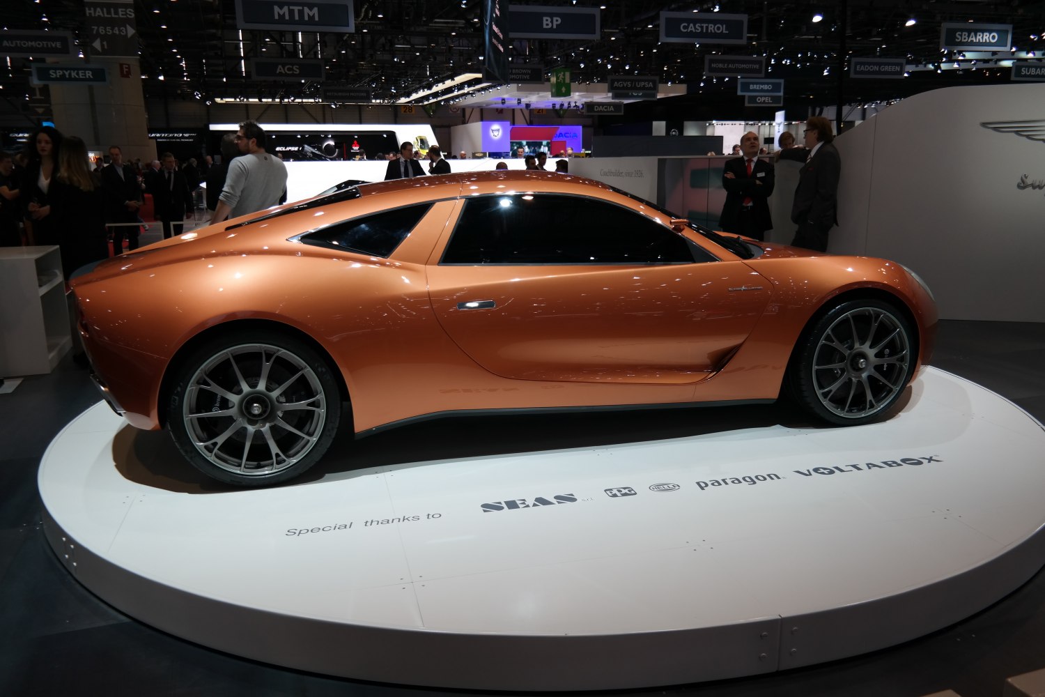 Aerodynamic electric sports coupe with alloy wheels and low-profile tires.