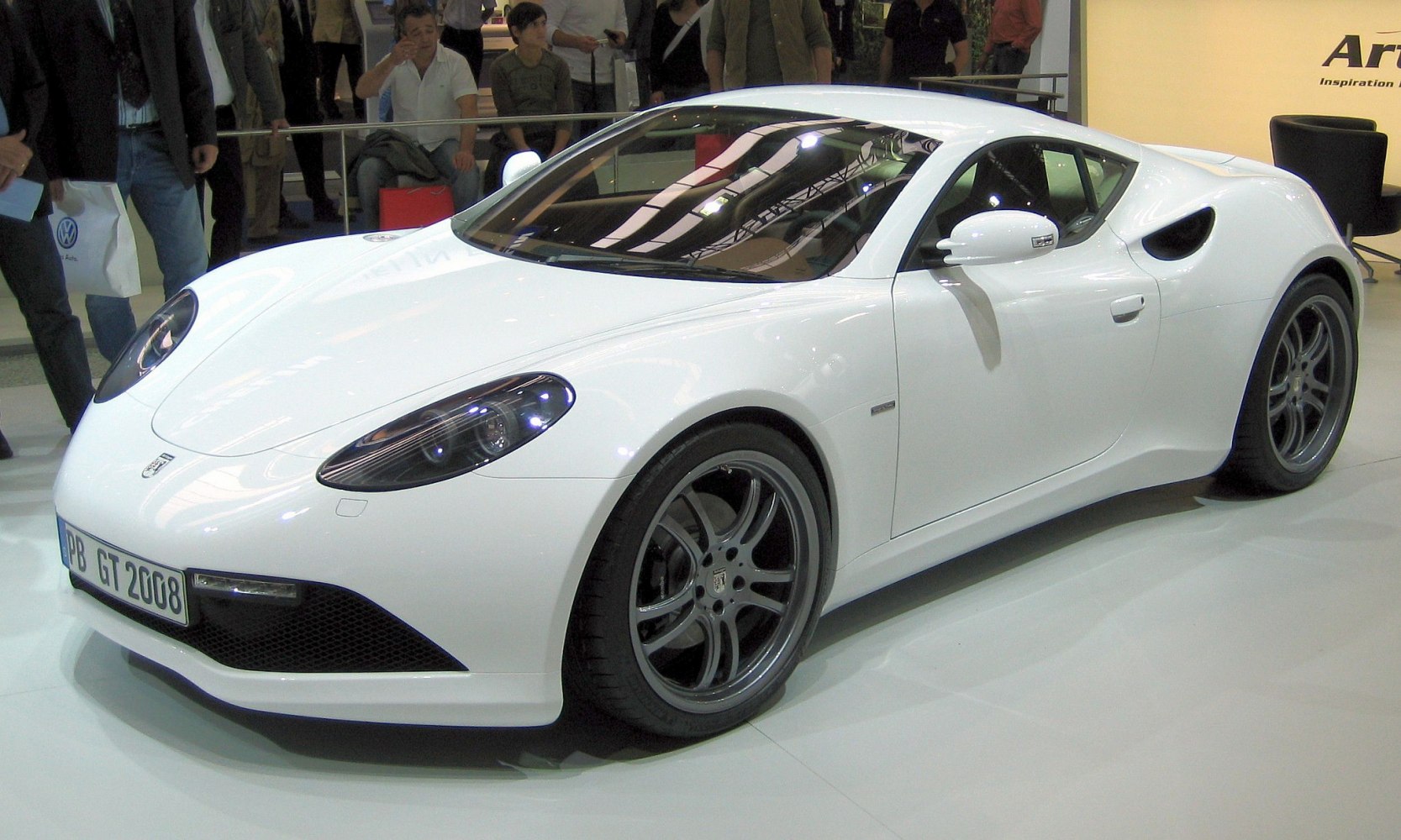White sports coupe with aerodynamic design and alloy wheels
