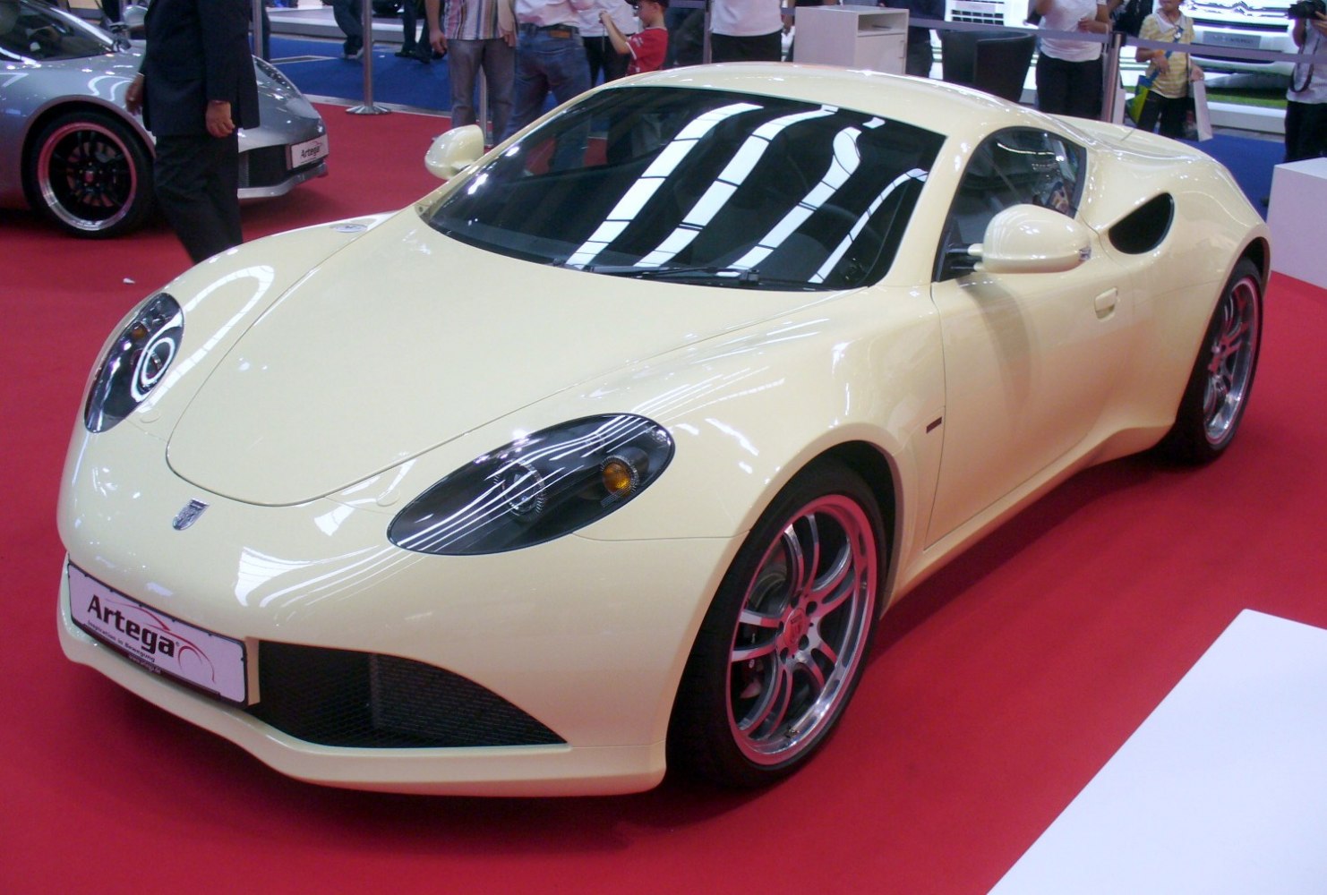 Sleek aerodynamic sporty coupe with alloy wheels and tinted headlights
