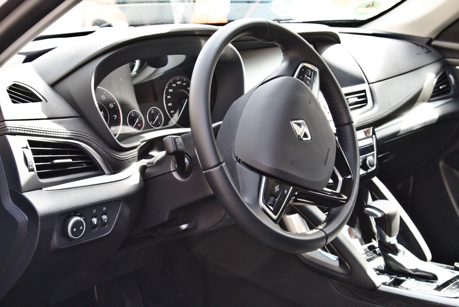 Close-up view of steering wheel and dashboard interior