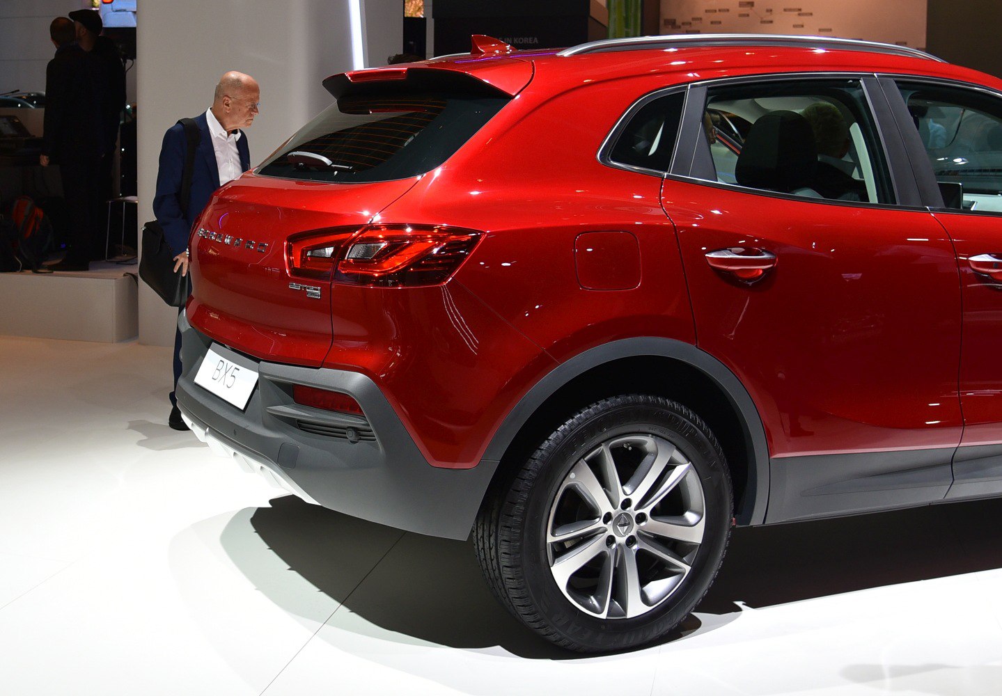 Red compact SUV rear side with alloy wheels and sporty design
