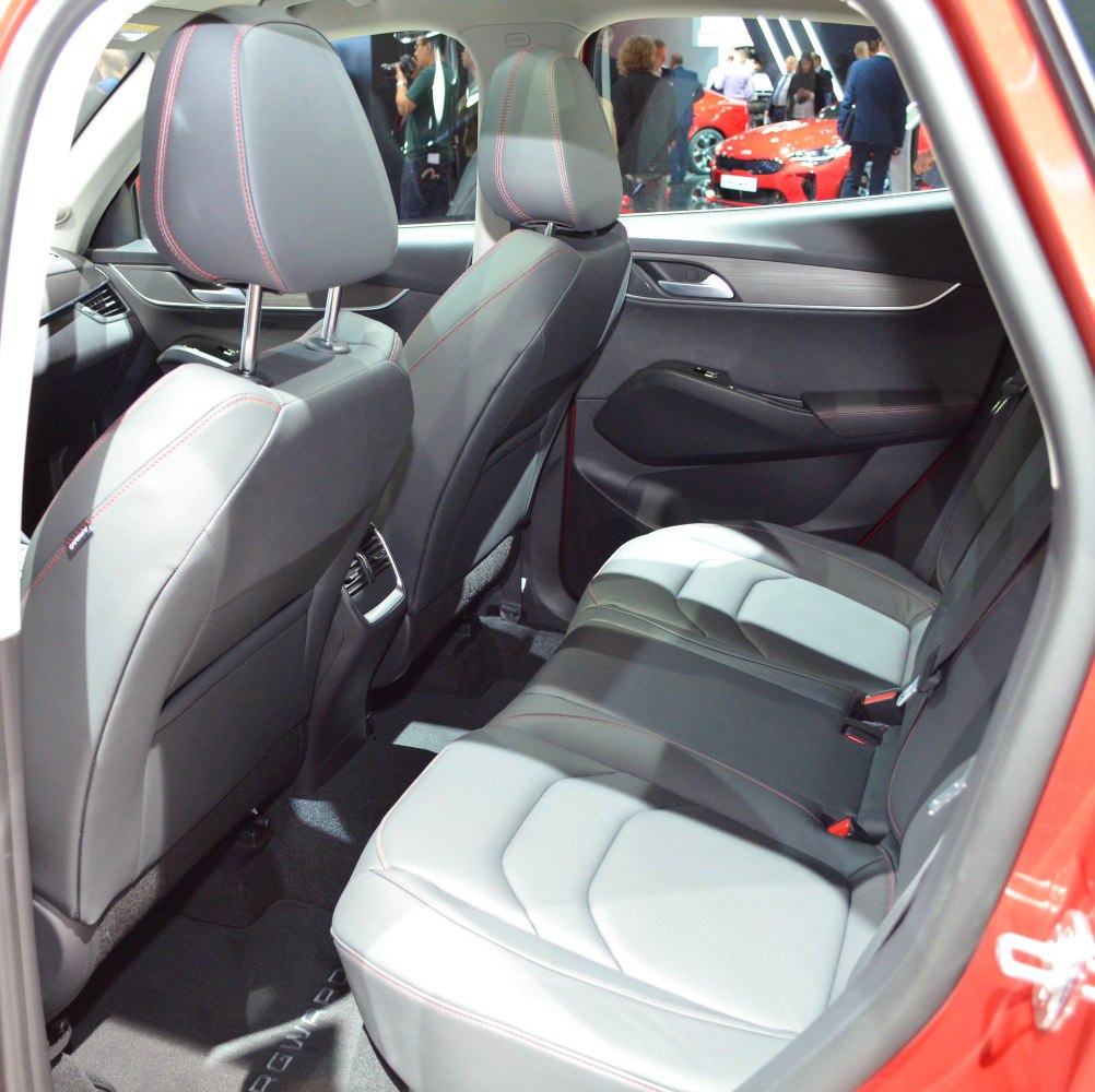 Rear seating area with leather seats and red stitching