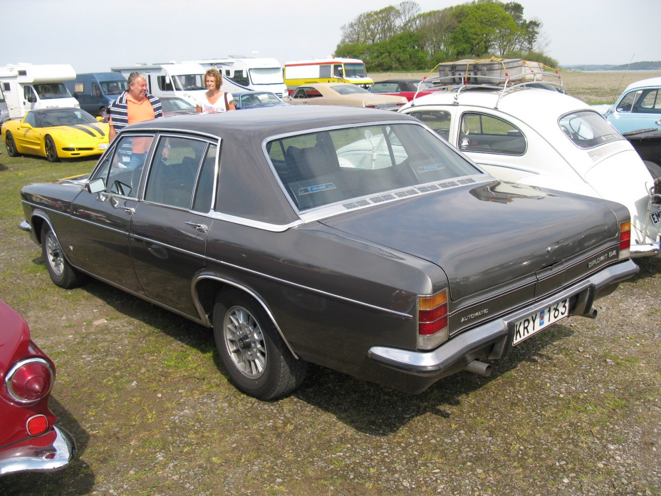 Classic 1970s luxury sedan rear with vinyl roof and chrome trim
