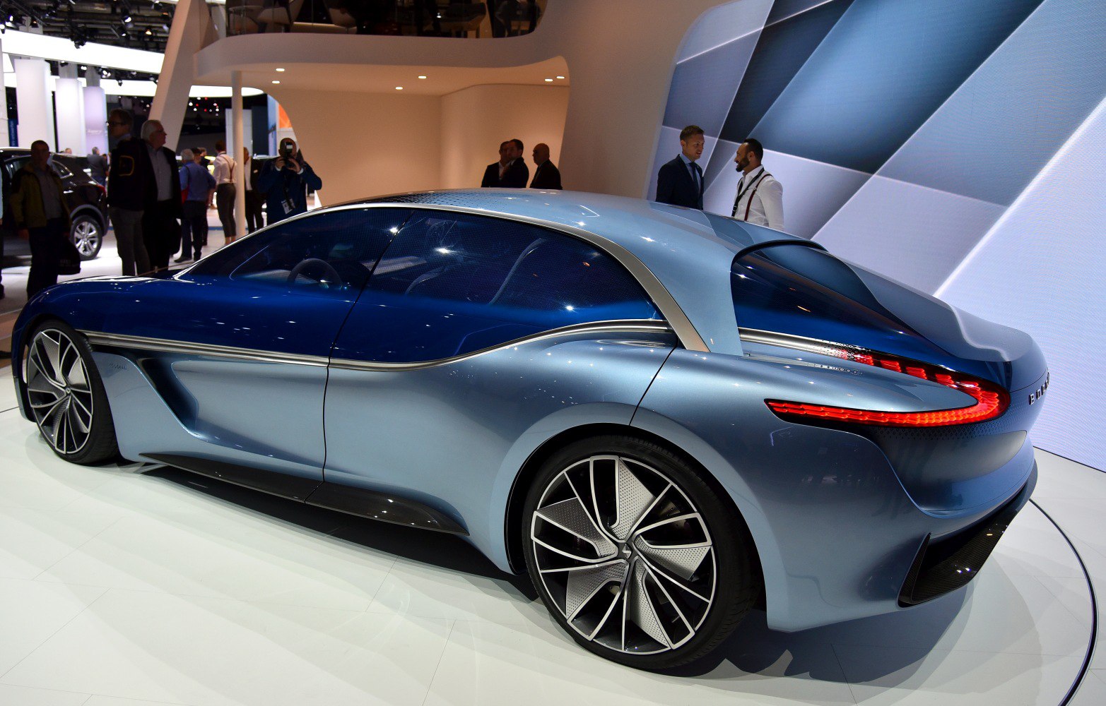 Aerodynamic side profile with large alloy wheels and futuristic rear lights