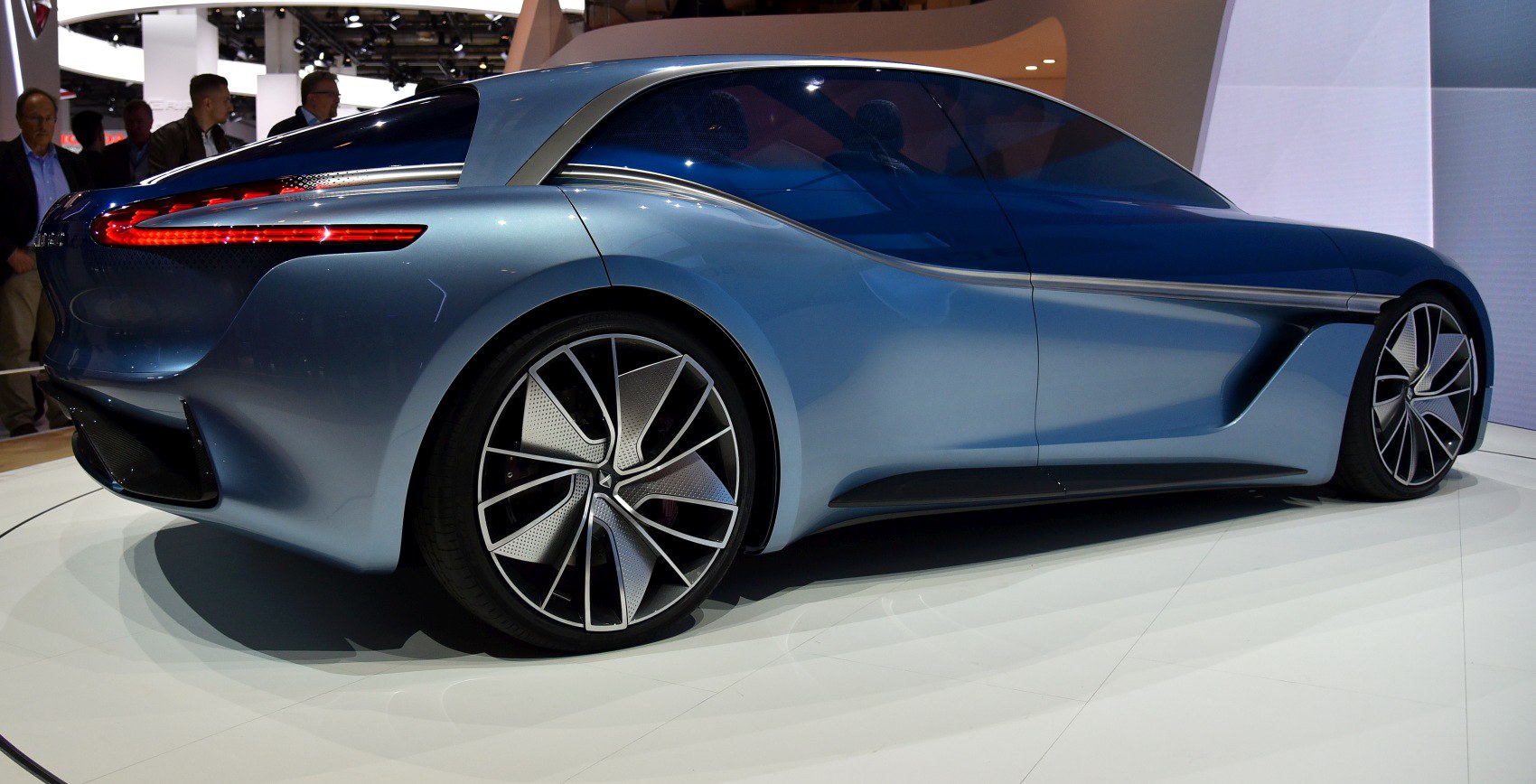 Sleek rear side profile with futuristic wheel design and integrated rear LED lights.