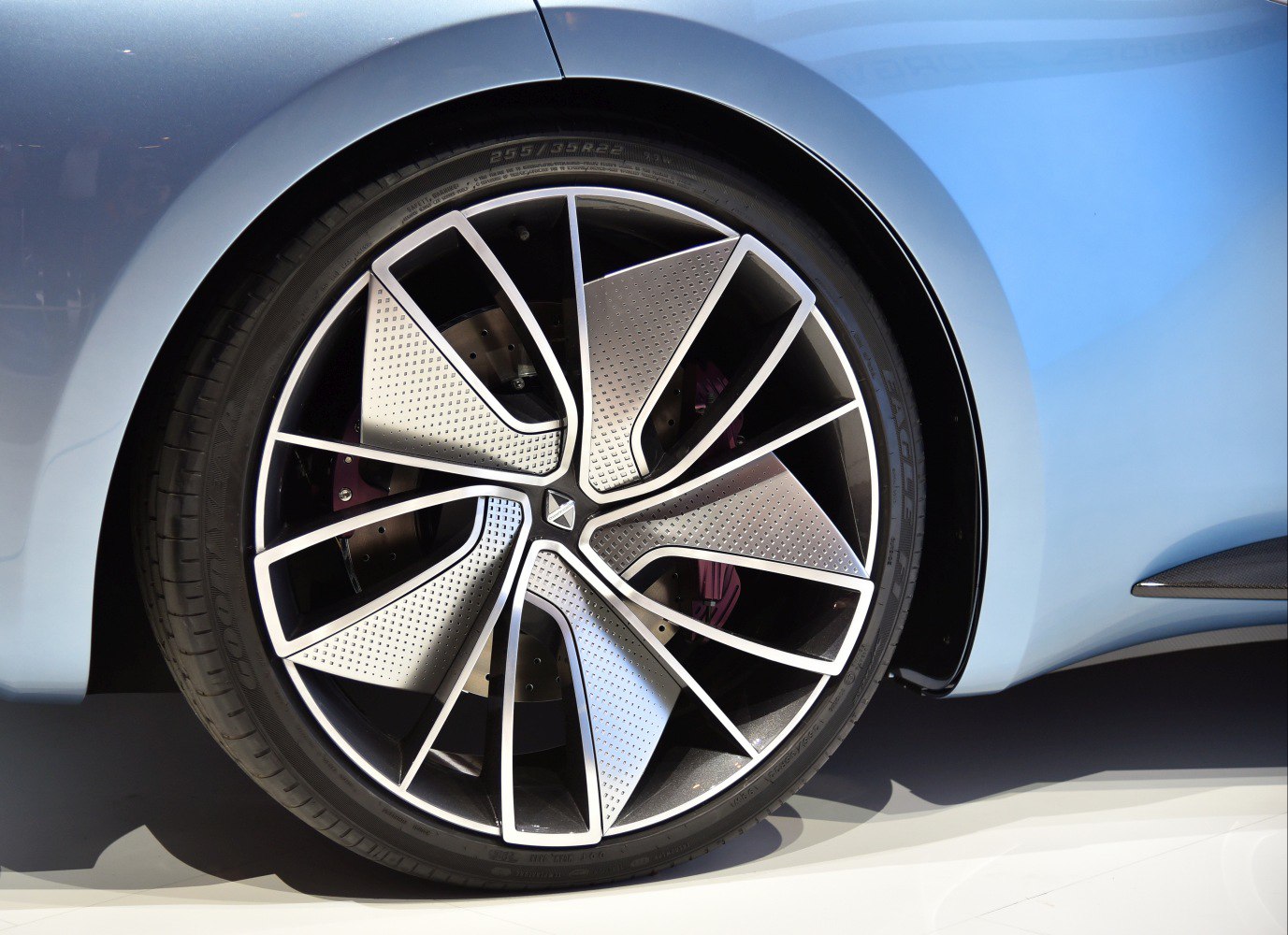 Modern perforated alloy wheel with intricate spokes
