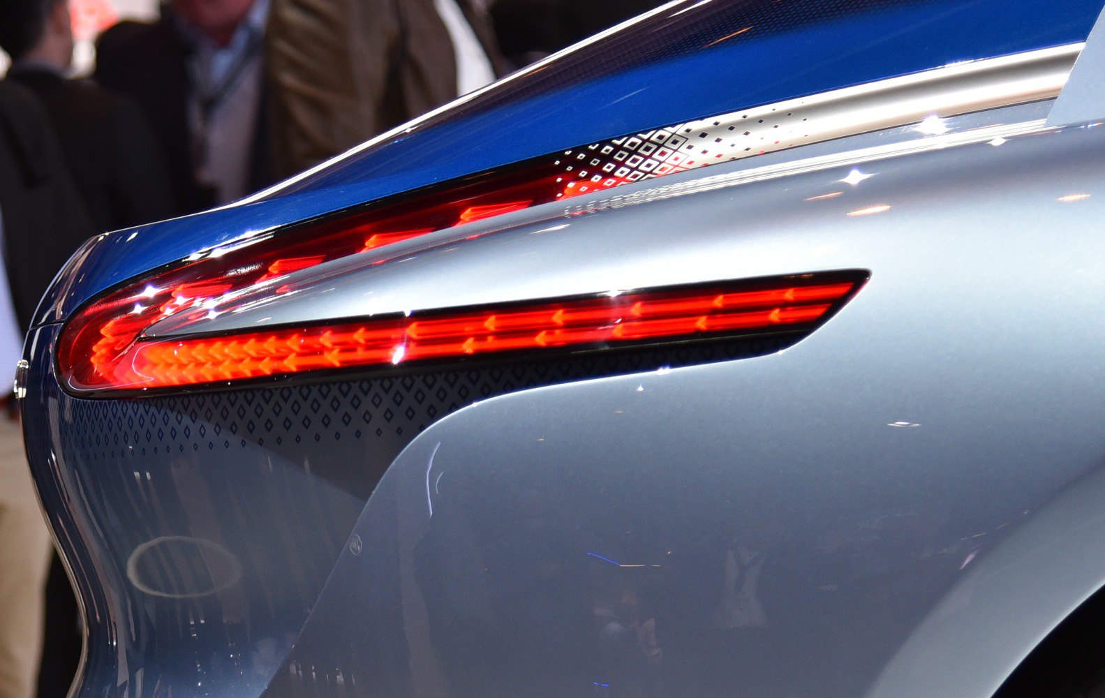 Close-up of modern rear LED taillight and sleek curved body panel