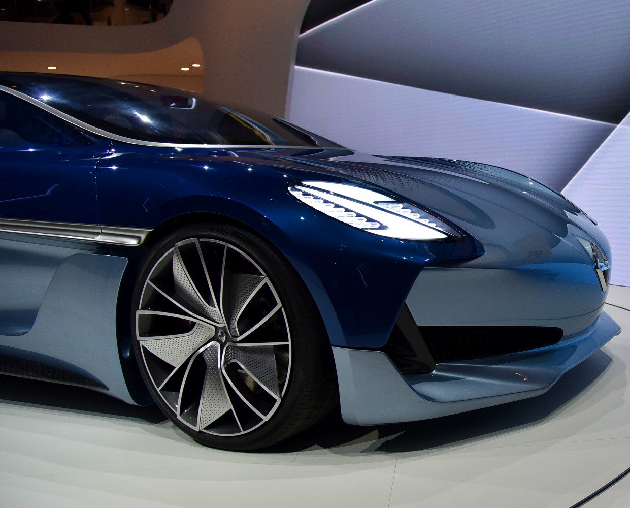 Aerodynamic front with futuristic LED headlights and modern wheels
