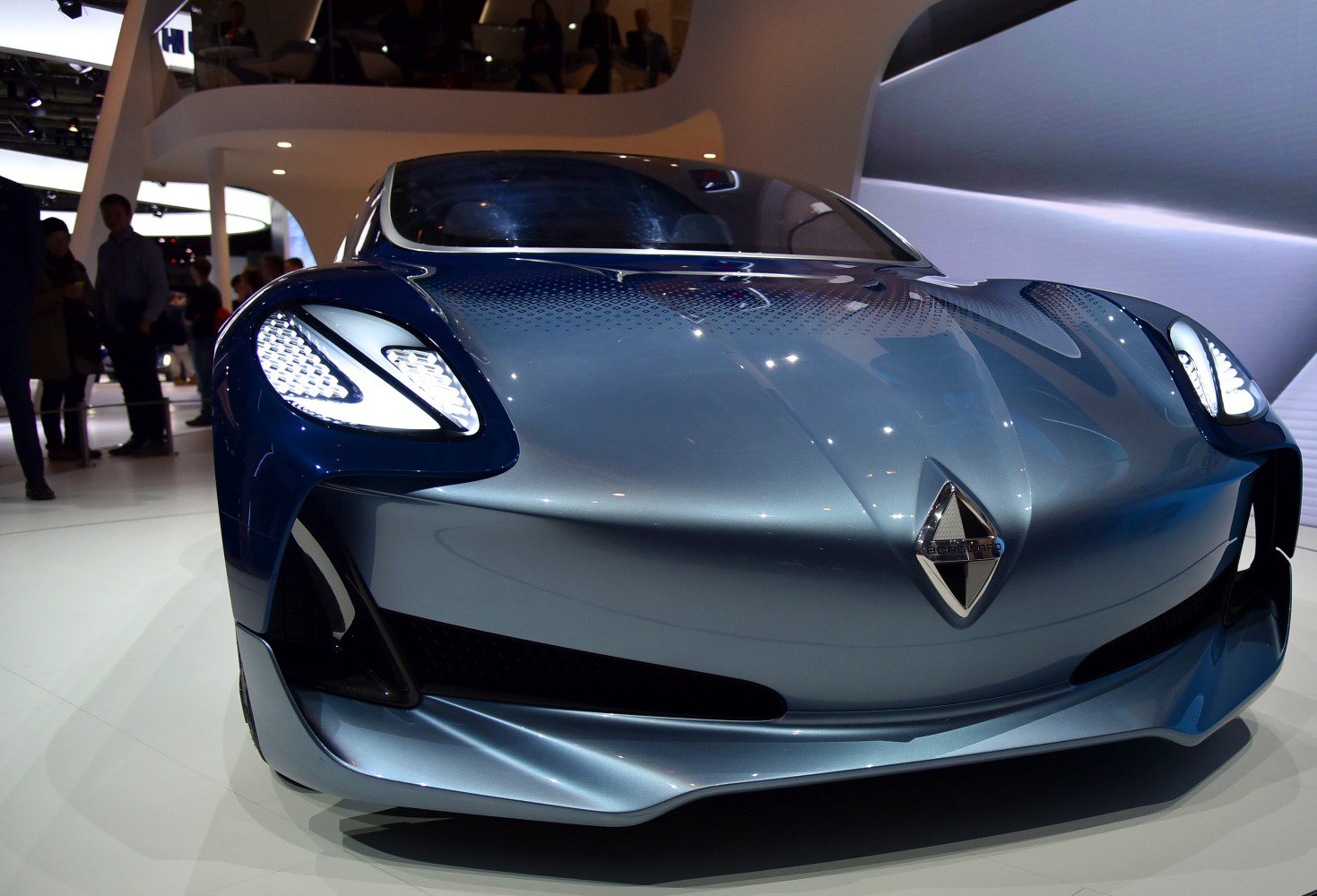 Sleek front design with futuristic LED headlights and a distinctive emblem