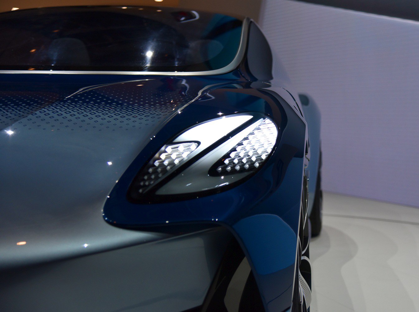 Close-up of LED headlight with aerodynamic body lines