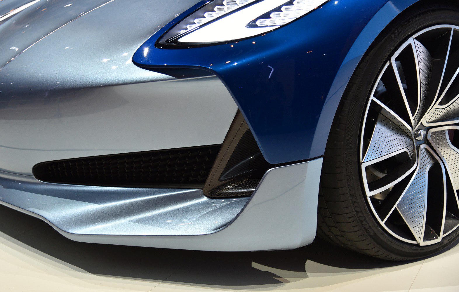 LED headlight and modern alloy wheel closeup