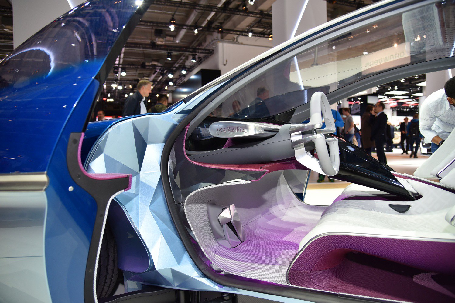 Futuristic car interior with unique steering wheel and geometric door design