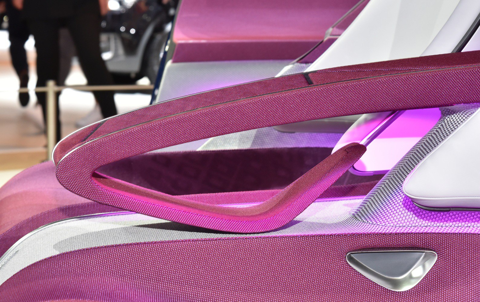 Innovative uniquely shaped car door handle with textured surface