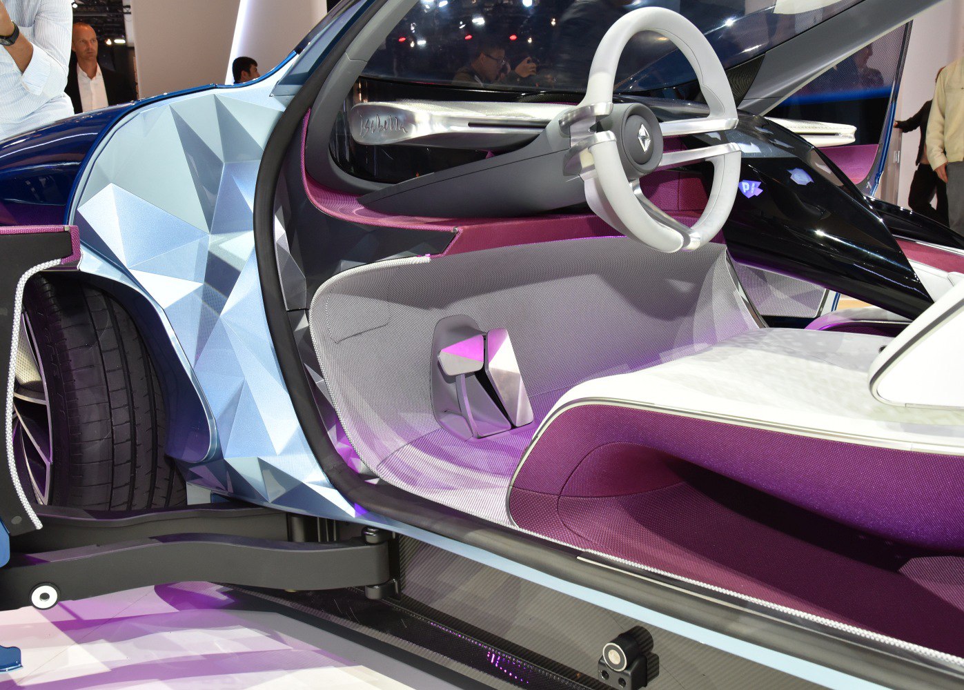 Futuristic steering wheel and purple fabric car interior design