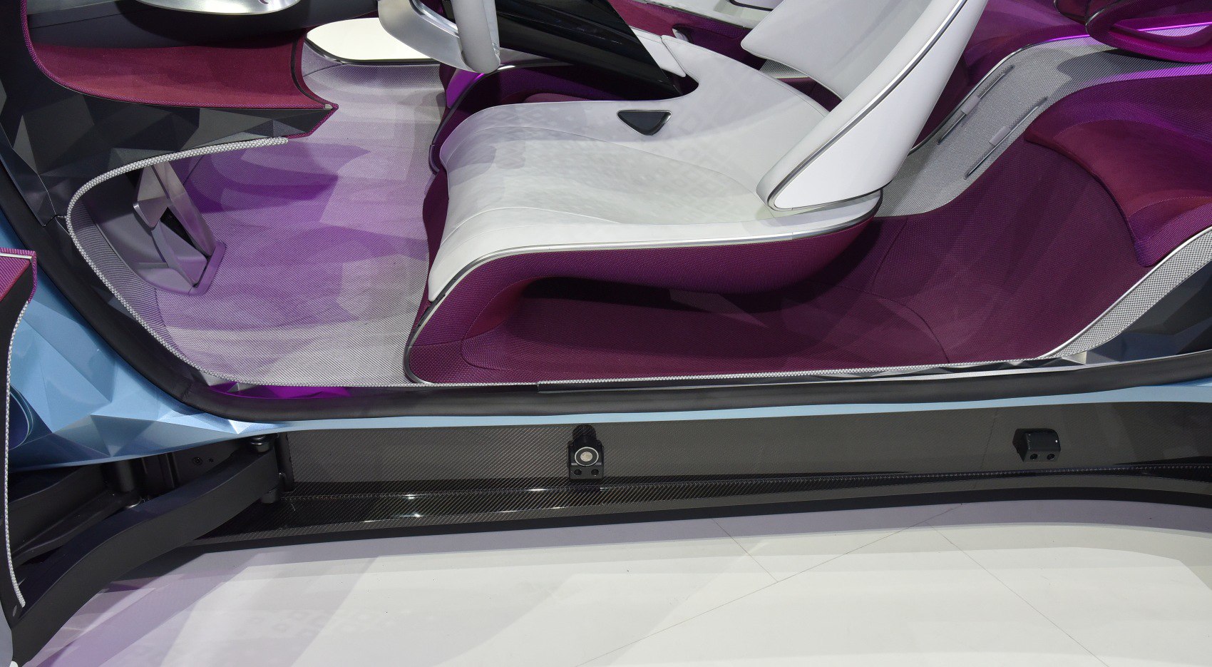 Futuristic seats with purple upholstery and white accents