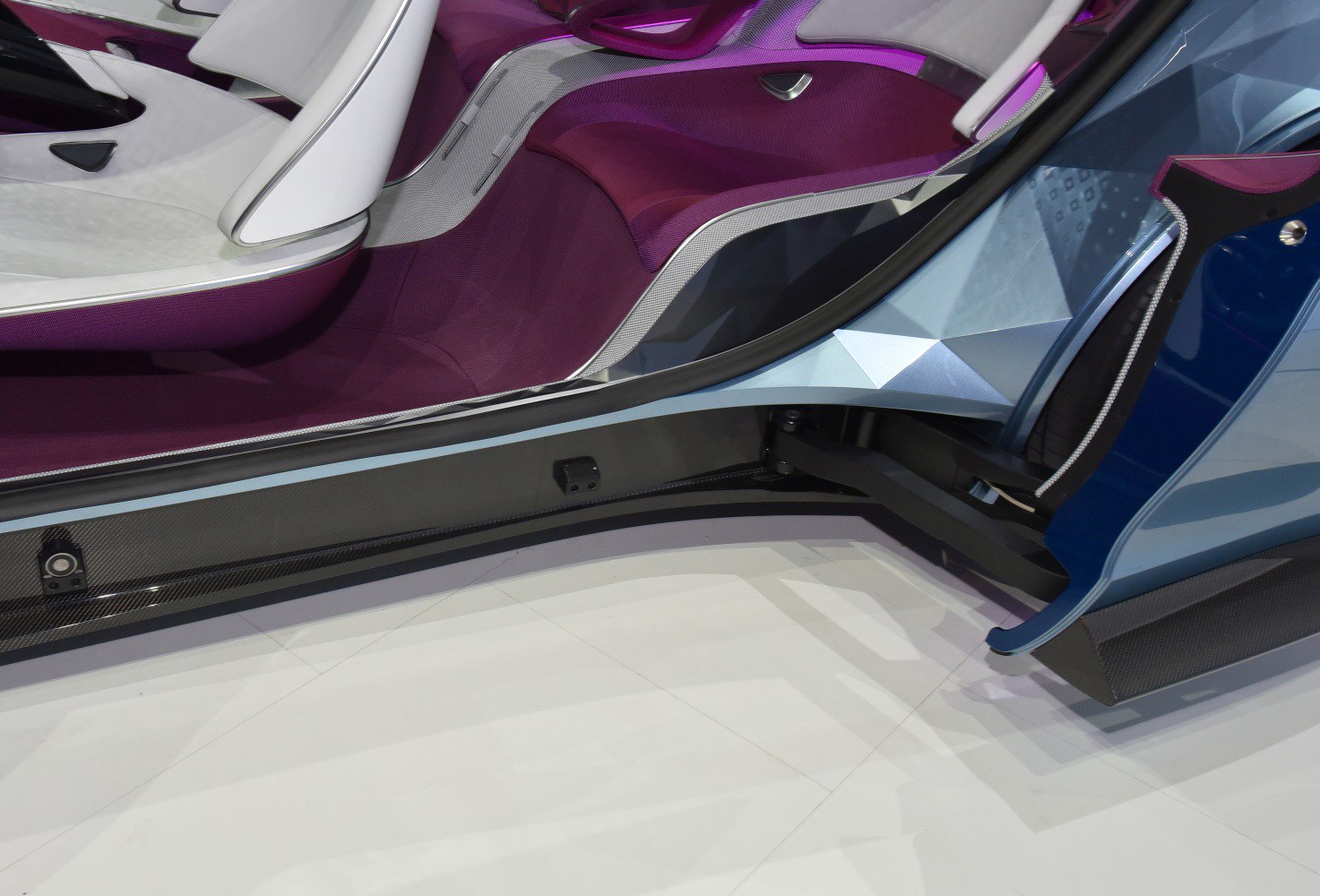 Futuristic car interior with unique door hinge mechanism