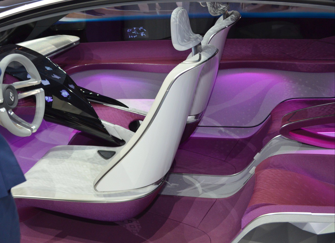 Futuristic white and purple car interior with sleek seats and modern steering wheel