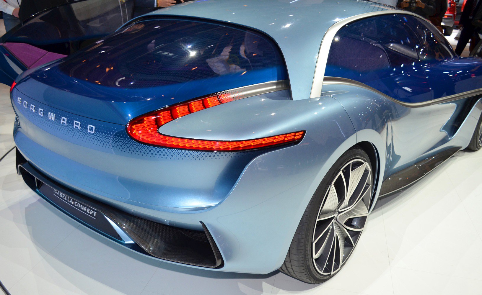 Sleek rear with futuristic LED tail lights and large stylized alloy wheels