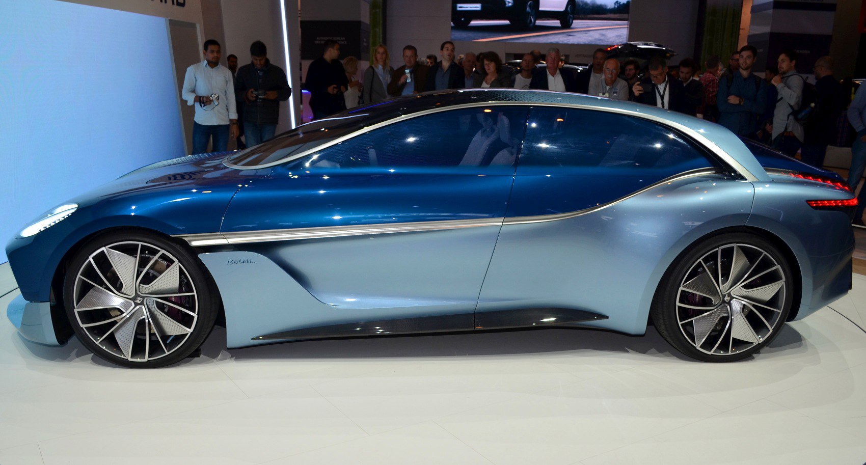 Sleek aerodynamic concept car with large alloy wheels and flowing design lines.