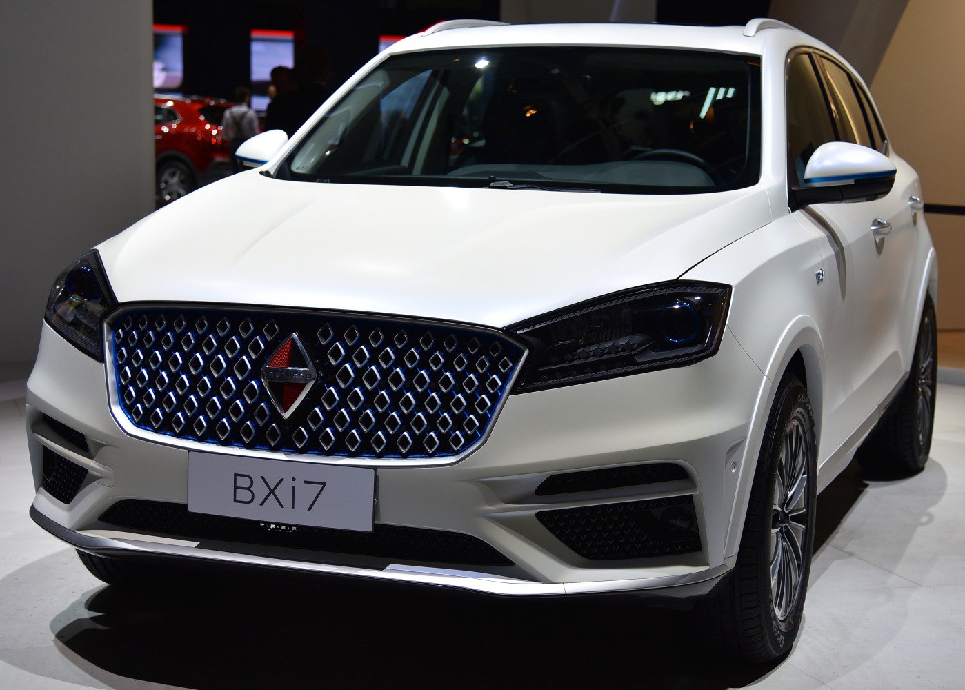 Front view of SUV with bold patterned grille and sleek headlights