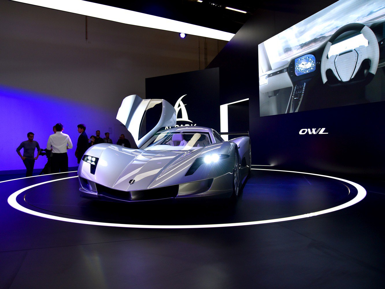 Electric supercar with butterfly doors and aggressive aerodynamic design