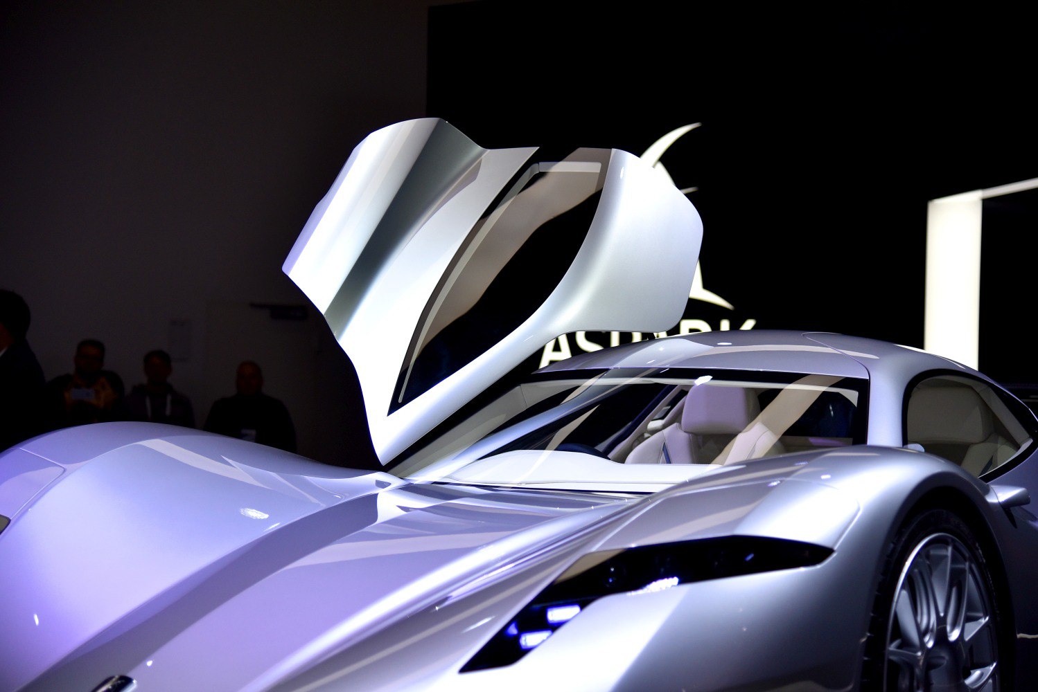 Futuristic gullwing door with aerodynamic silver body and sleek curves