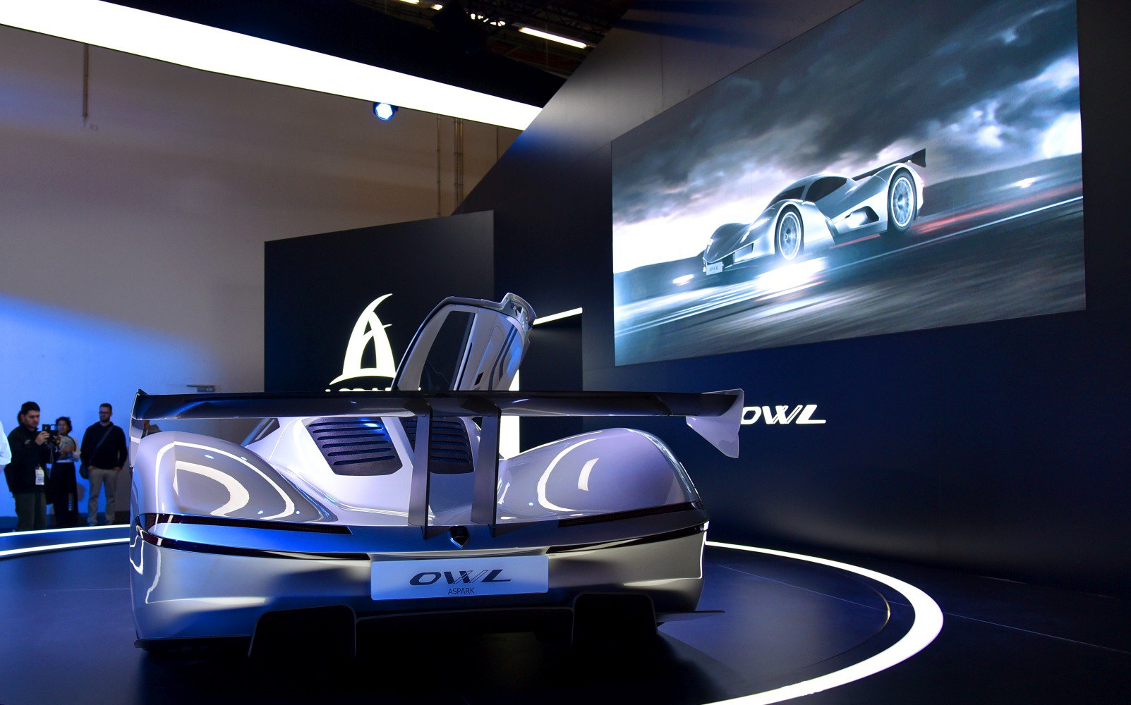 Sleek rear design with large rear wing and aerodynamic features