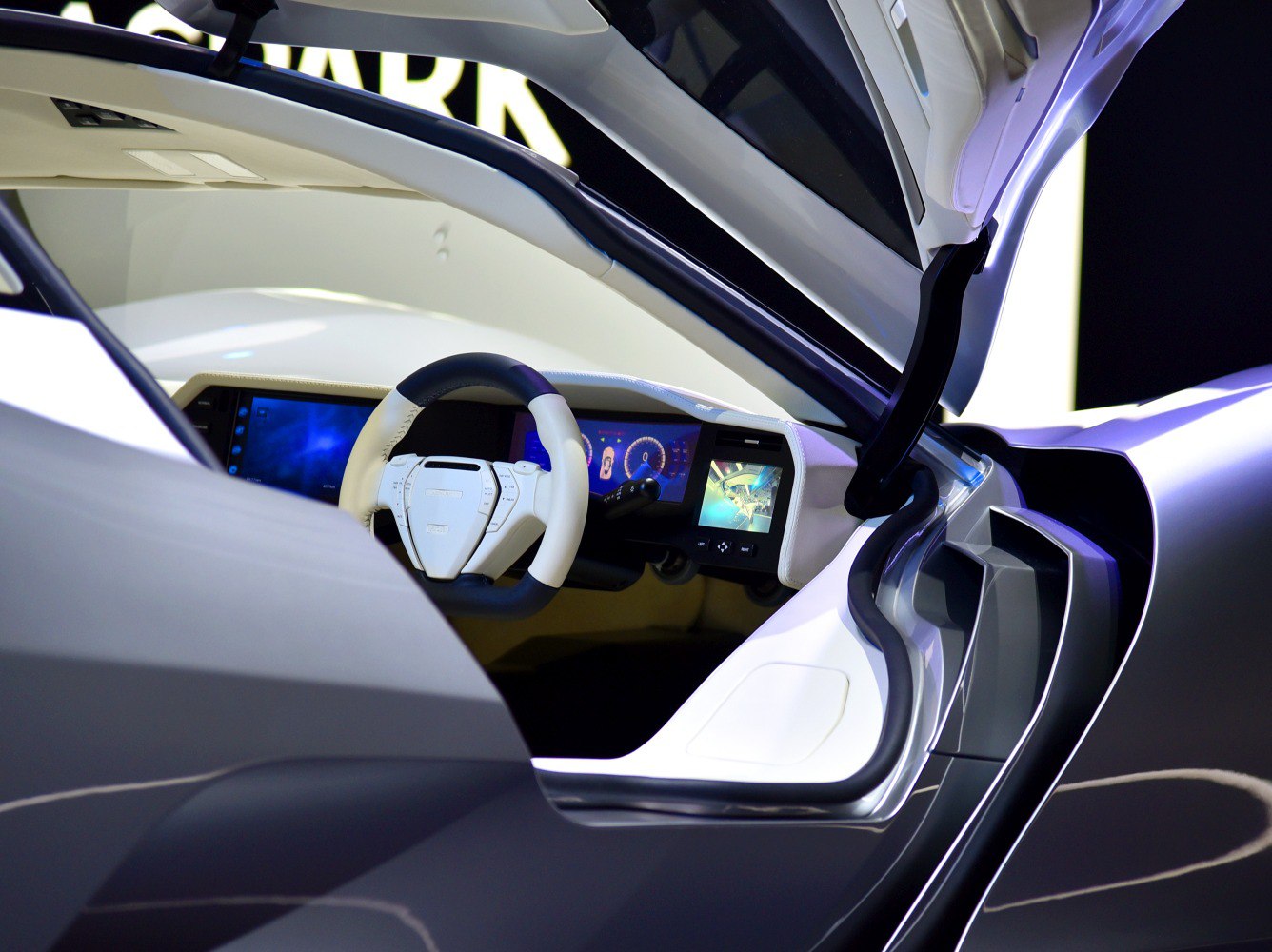 Futuristic cockpit with dual-tone steering and digital dashboard displays