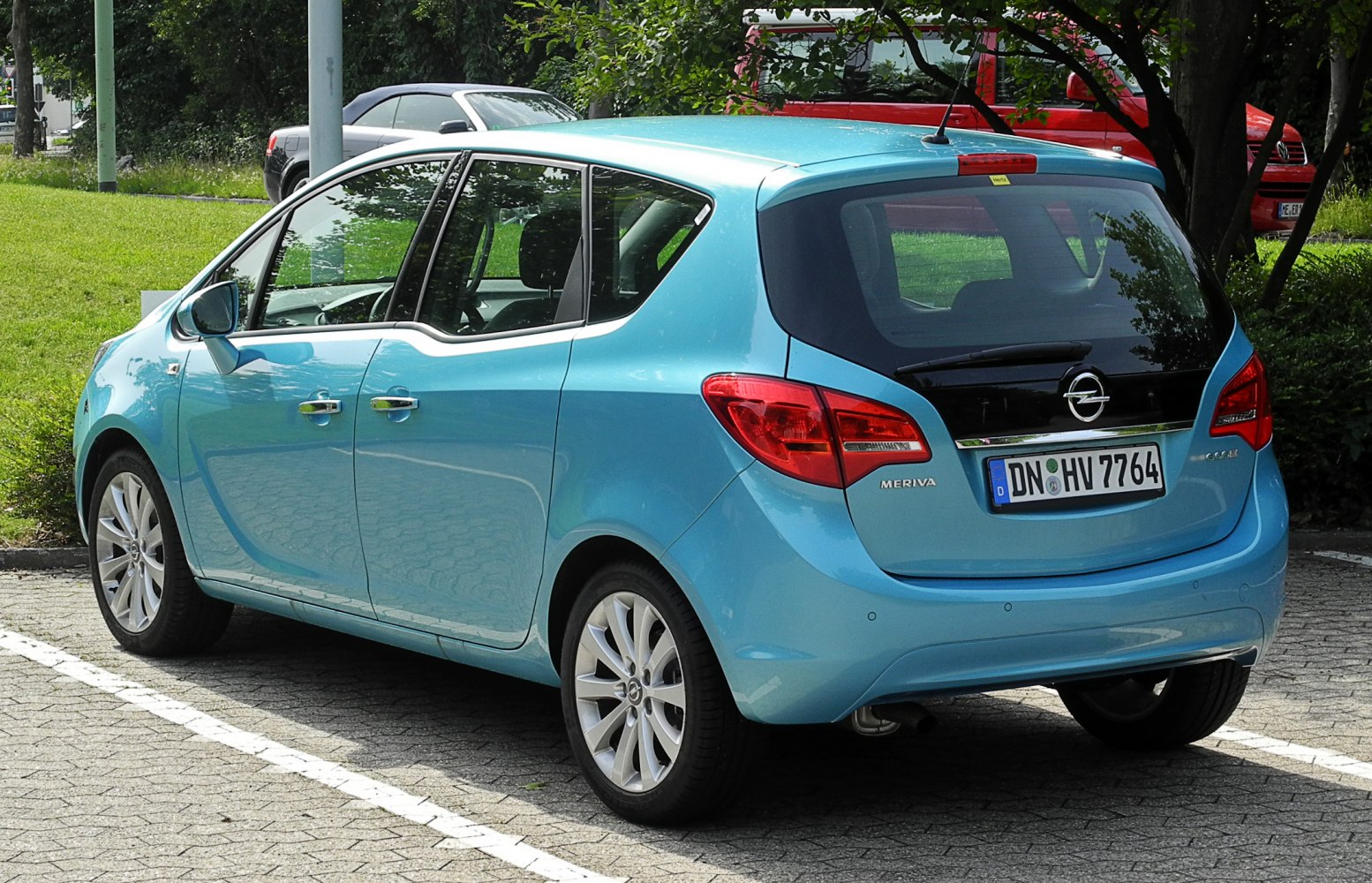 Compact hatchback rear with unique tail lights and wide rear window