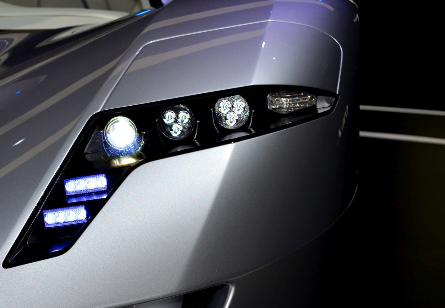 Close-up of LED headlight assembly with multiple light units.