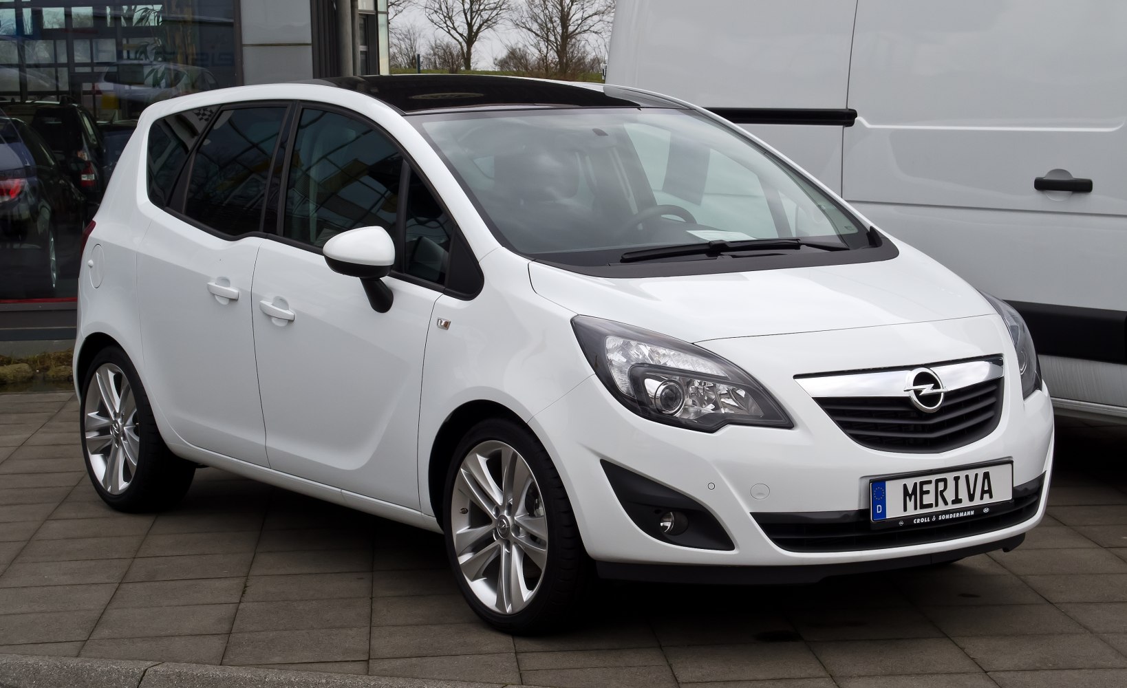 White hatchback with panoramic sunroof and alloy wheels