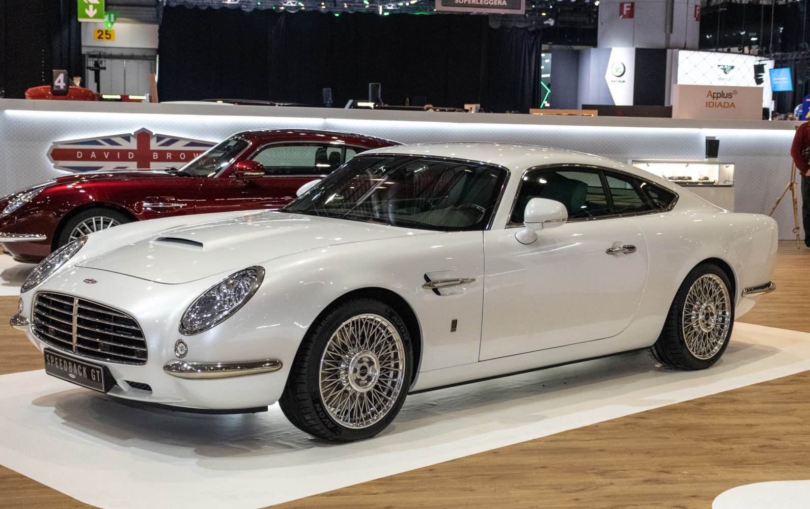 Luxury coupe with retro design, hood scoop, and wire spoke wheels
