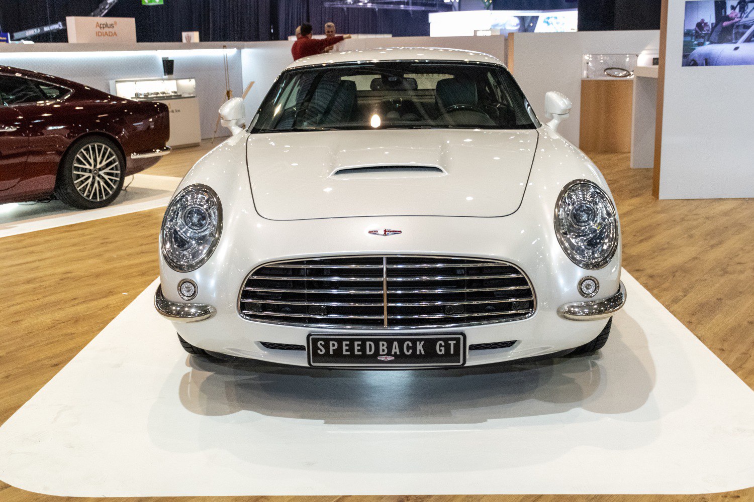 Front view with chrome grille and round headlights