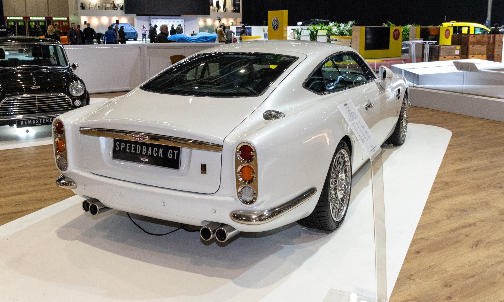 Rear view with round tail lights and intricate wire wheels