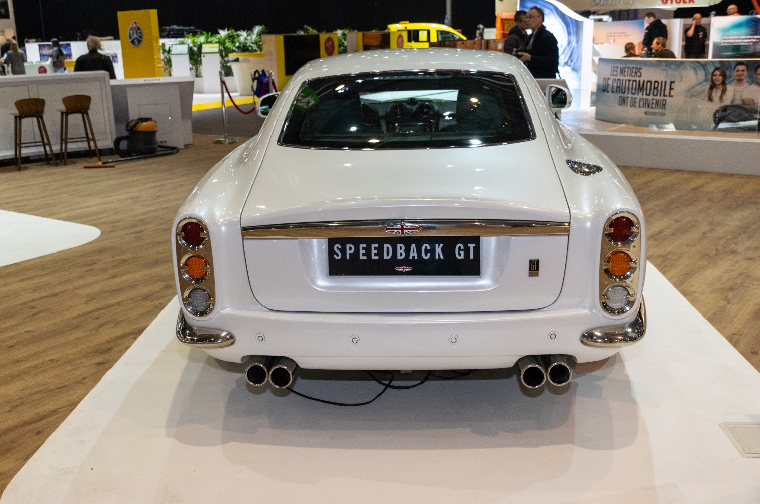 Classic tail lights and quad exhaust tips on rear design