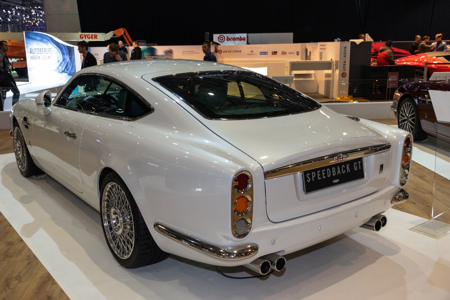 Classic rear design with dual exhausts and wire-spoke wheels.
