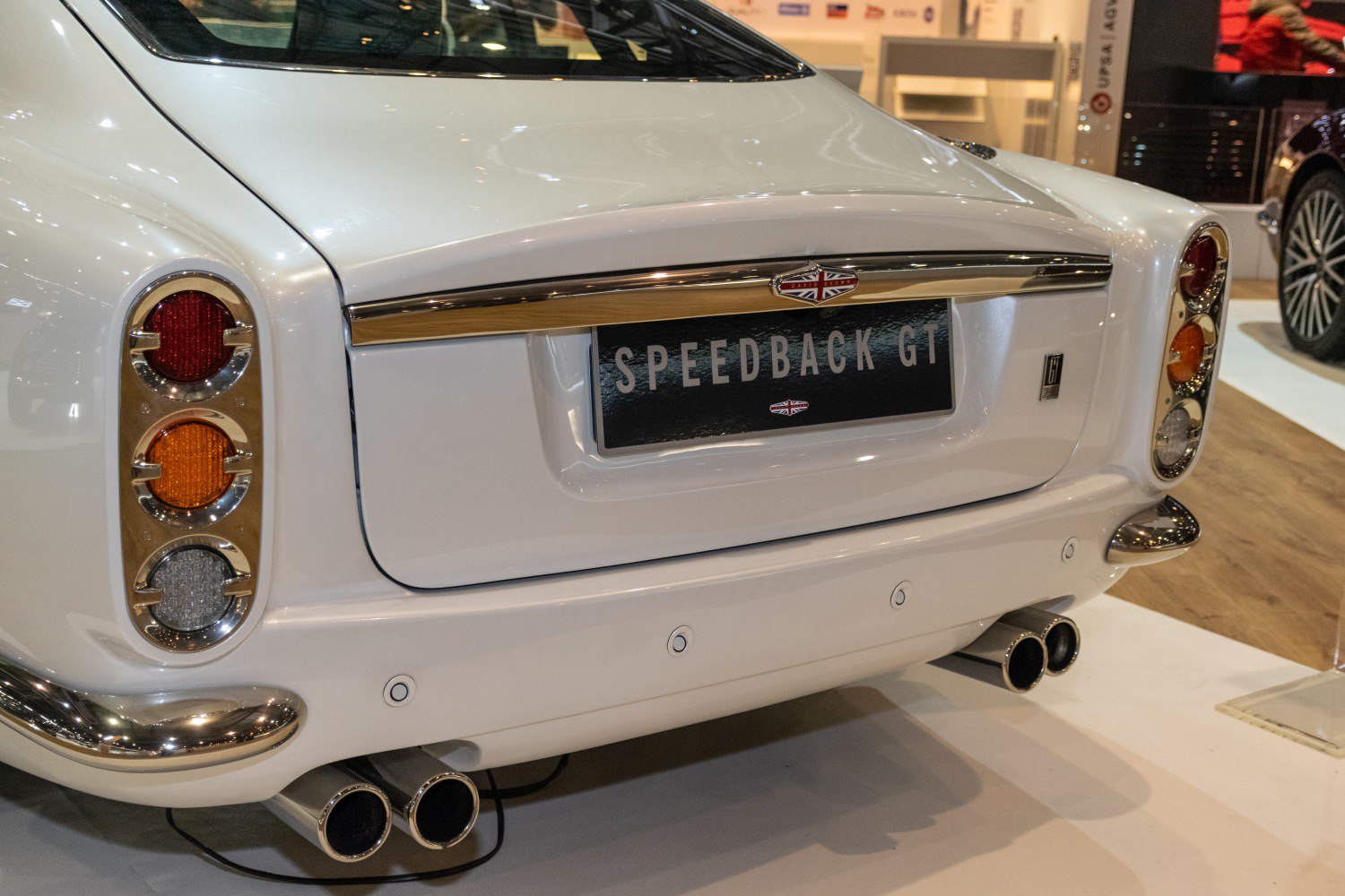 Classic rear design with vertical tail lights and quad exhaust pipes