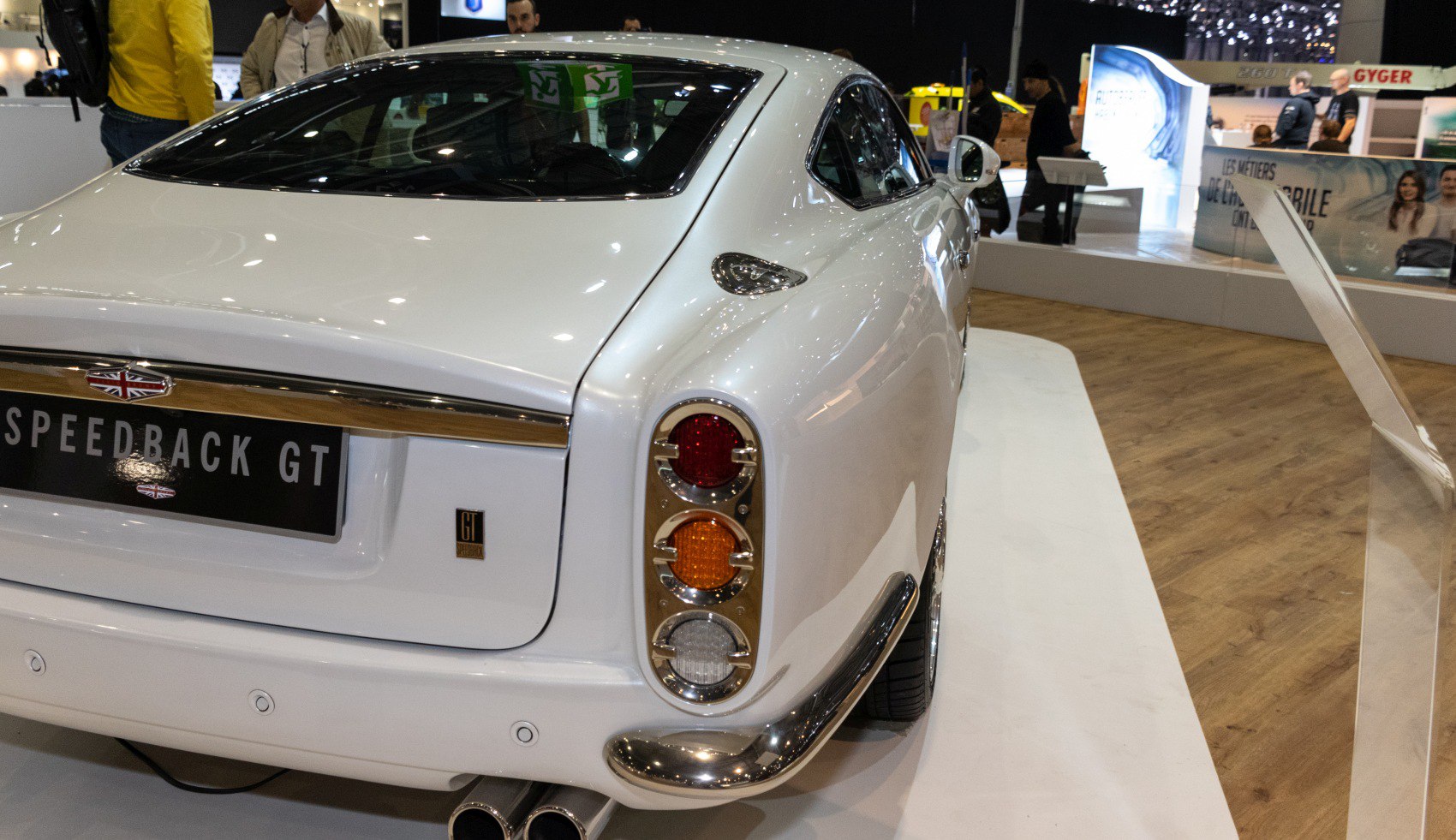 Rear view of classic 3-light tail cluster and chrome bumper