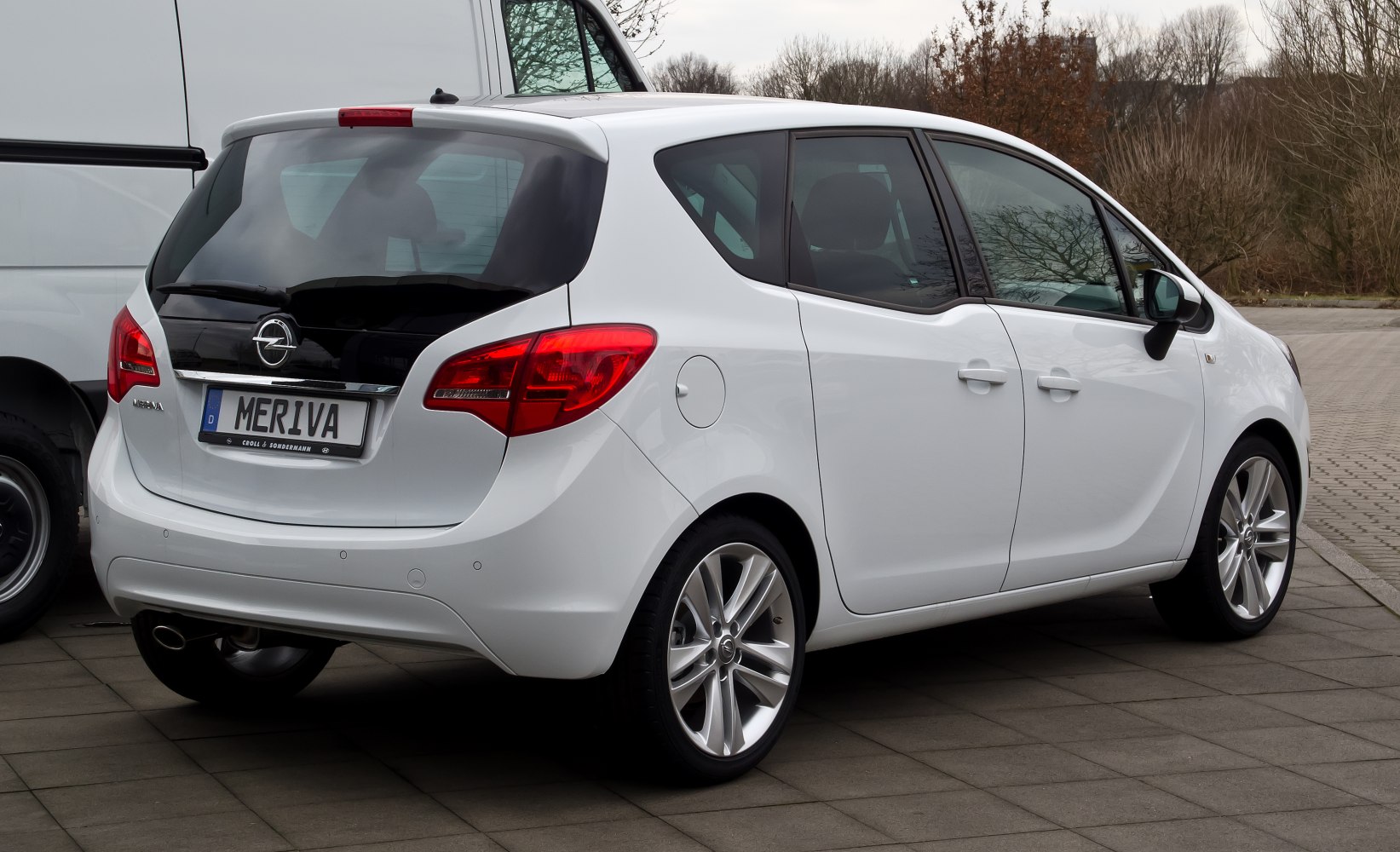 Rear and side view of a compact hatchback with modern lights and body contours