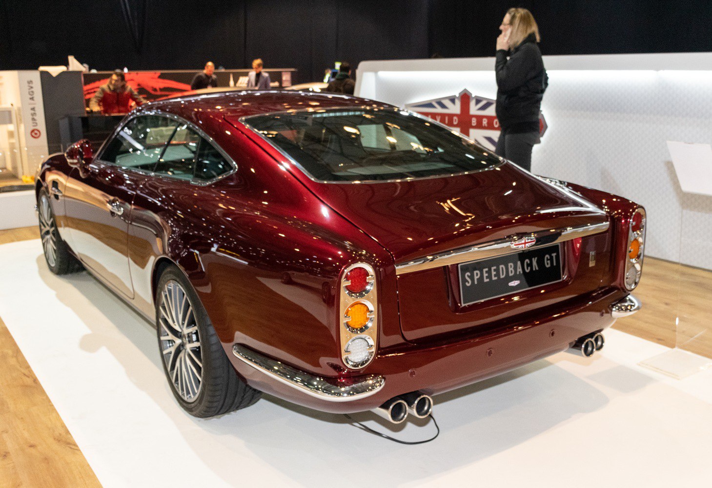 Rear view of classic luxury coupe with distinctive tail lights and quad exhaust
