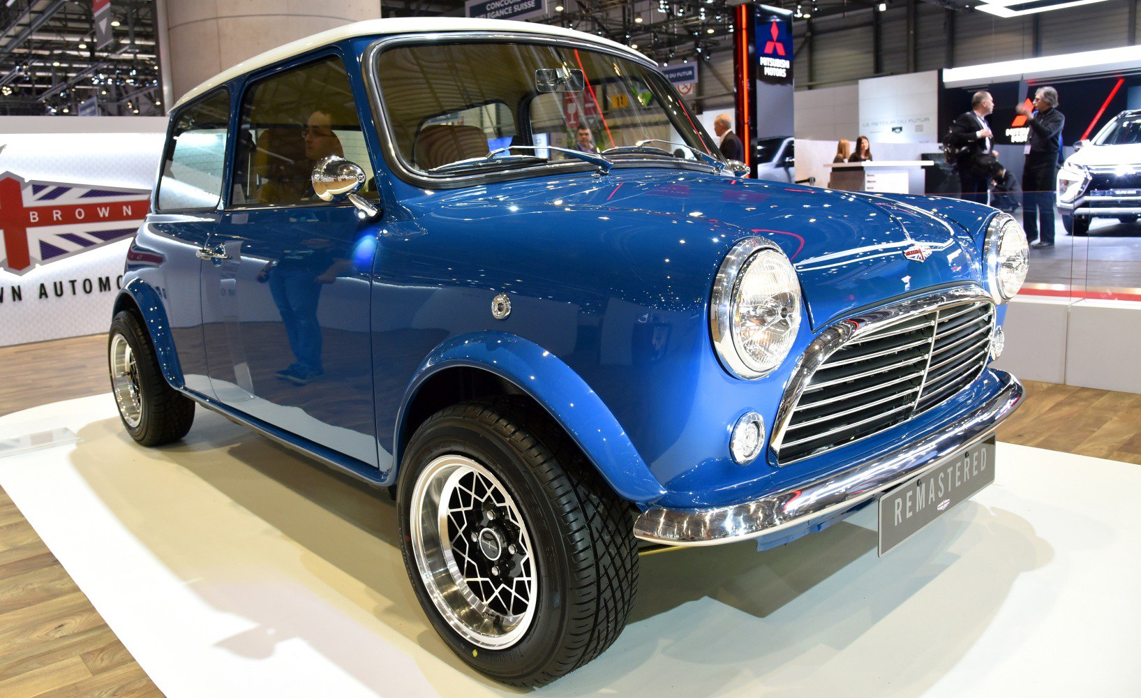 Blue vintage Mini with chrome grille and round headlights