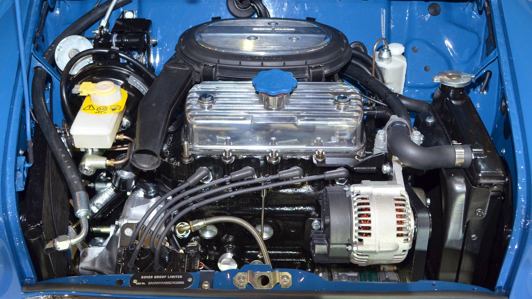Engine bay close-up with polished valve cover and alternator